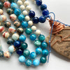 long earthy blue and white beaded, copper wire wrapped sea stone pendant necklace
