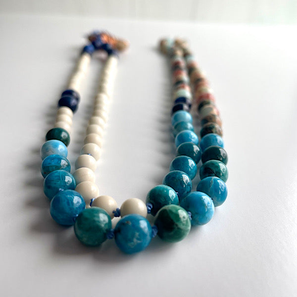 long earthy blue and white beaded, copper wire wrapped sea stone pendant necklace