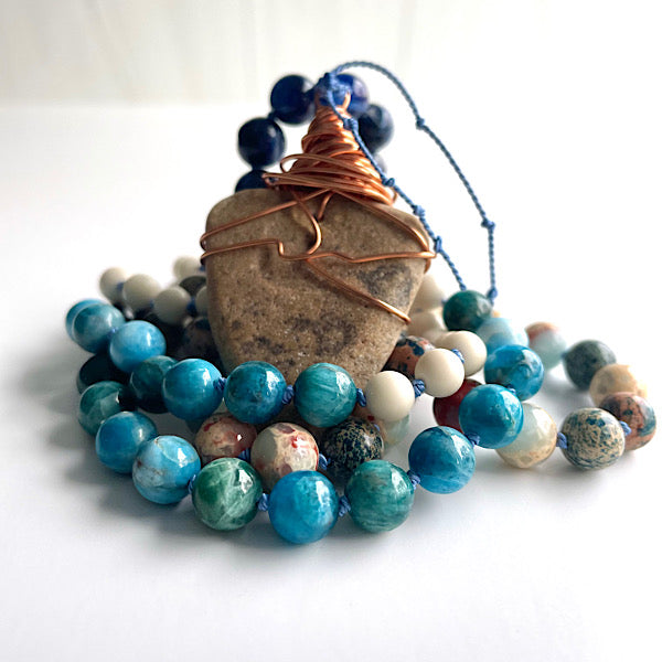 long earthy blue and white beaded, copper wire wrapped sea stone pendant necklace